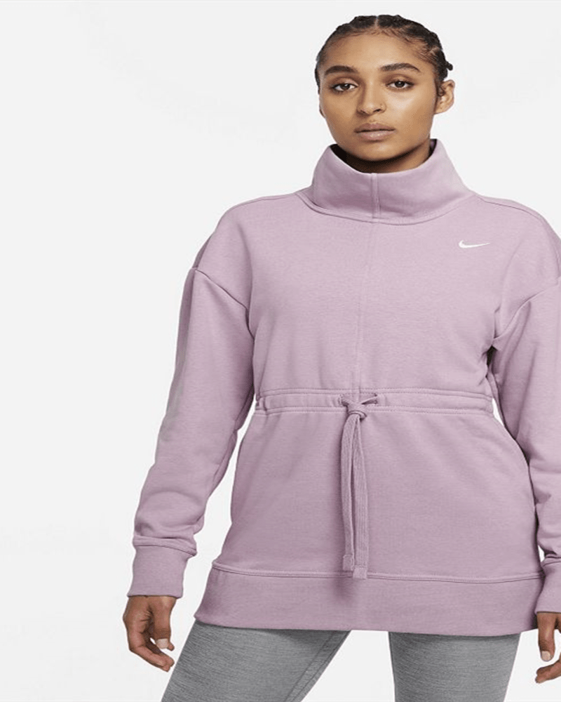 Front of a model wearing a size 1X Nike Women's Plus Dri FIT Get Fit Pullover Training Top Purple Size 1X in Purple by Nike. | dia_product_style_image_id:311310